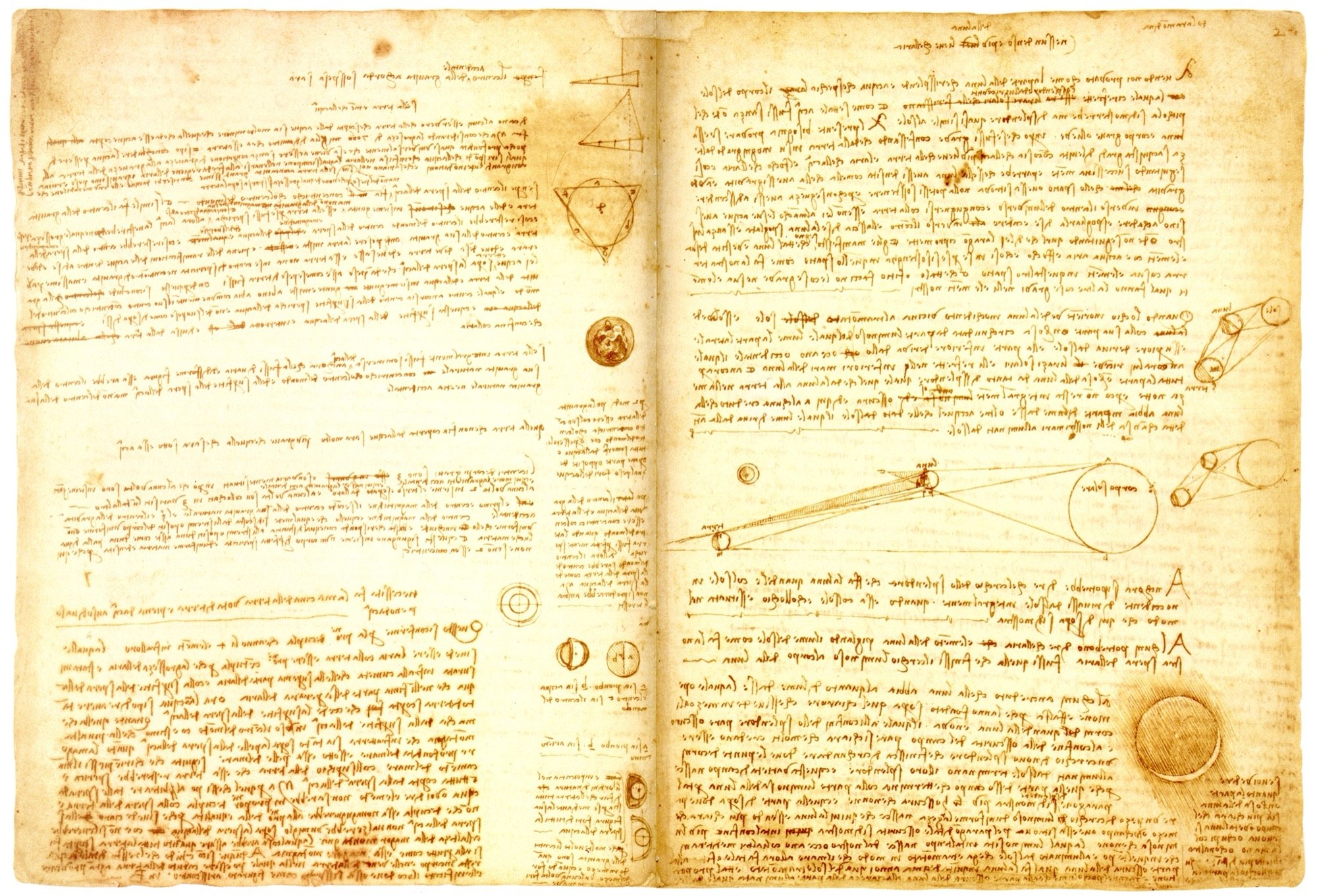 An open Leonardo notebook spread of mirror writing with diagrams set into the text